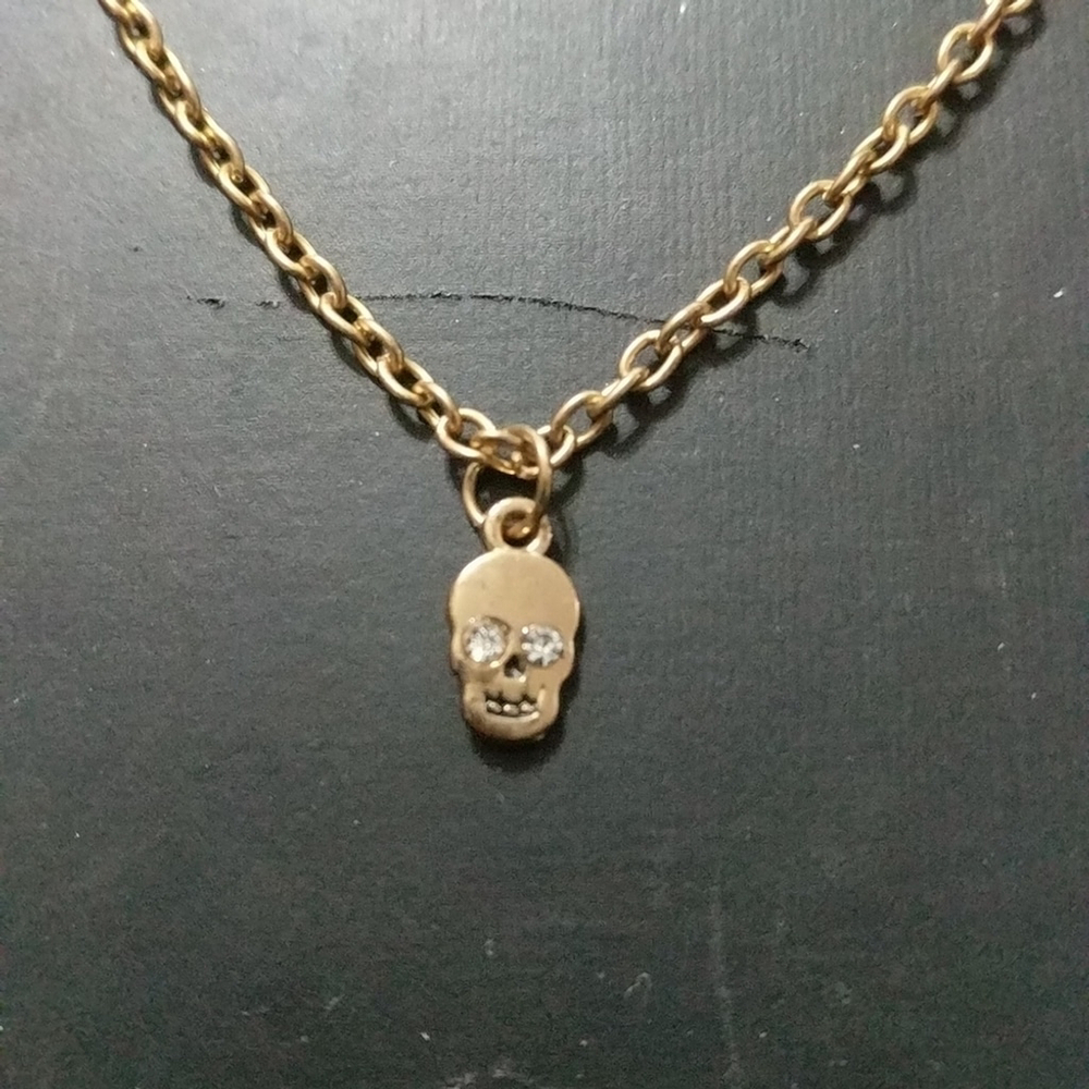 Gold Tone Tiny Skull with Rhinestone Eyes Statement Necklace